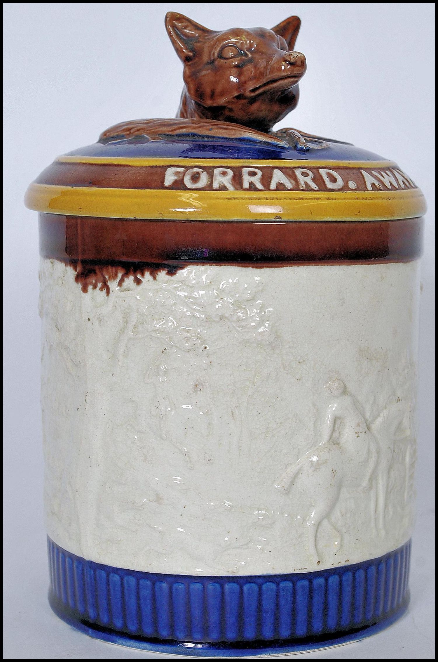 A 19th century Wedgwood majolica tobacco jar having a fox finial to the lid with inscription '