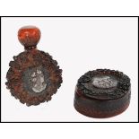 Two vintage early 20th century carved amber bakelite items consisting of a perfume bottle of moon