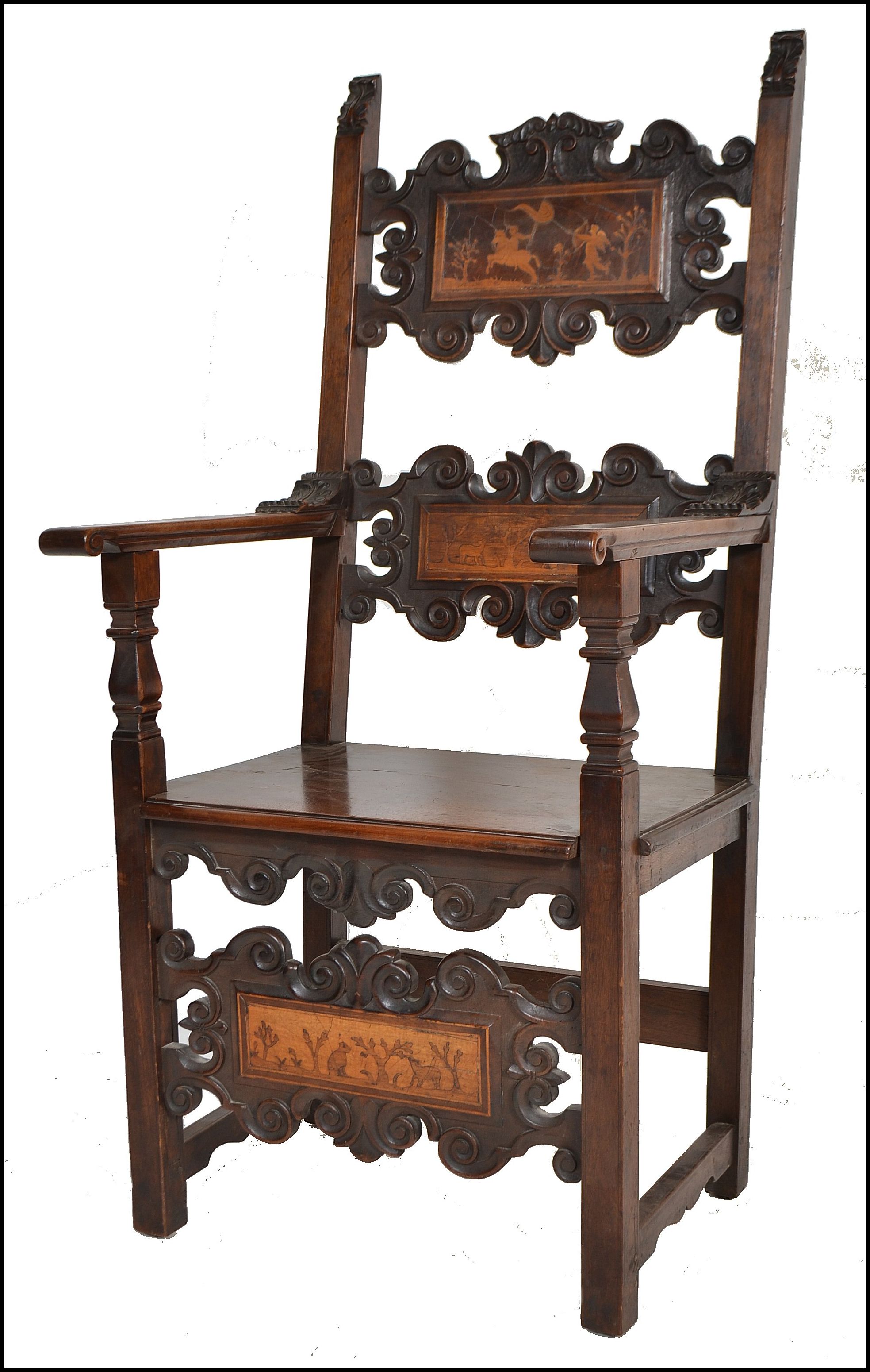 A circa 17th century Italian walnut and marquetry inlaid armchair. The chair being raised on block