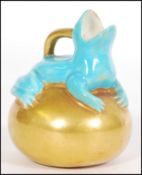 An unusual Copeland small jug or ewer, modelled with a turquoise frog sitting on a golden orb, green