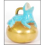 An unusual Copeland small jug or ewer, modelled with a turquoise frog sitting on a golden orb, green