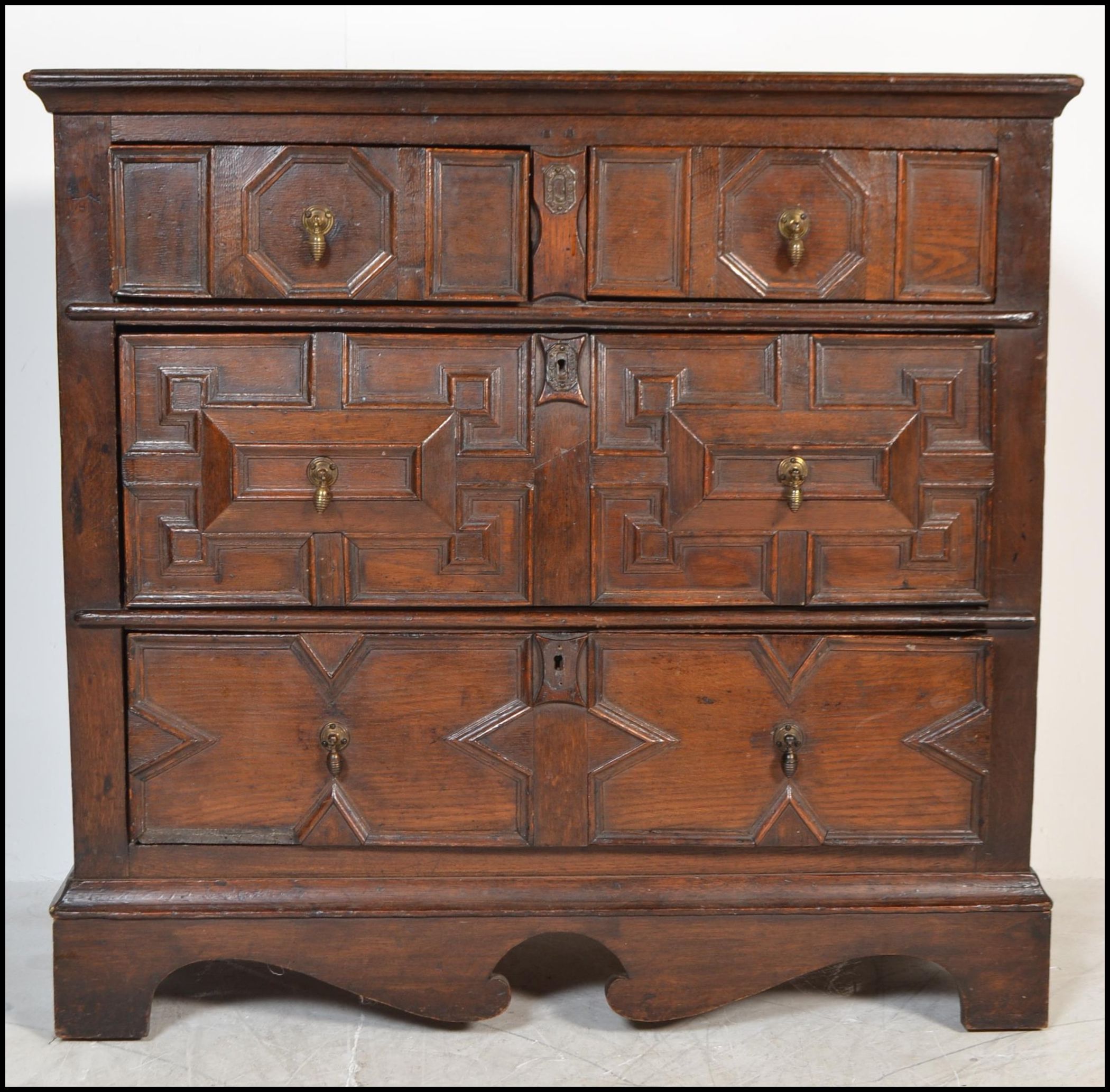 A 17th century Commonwealth oak block fronted chest of drawers. The bank of four drawers having - Image 10 of 16