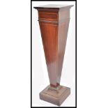 An Edwardian mahogany and line inlaid plant / bust stand. Raised on a square terraced base with