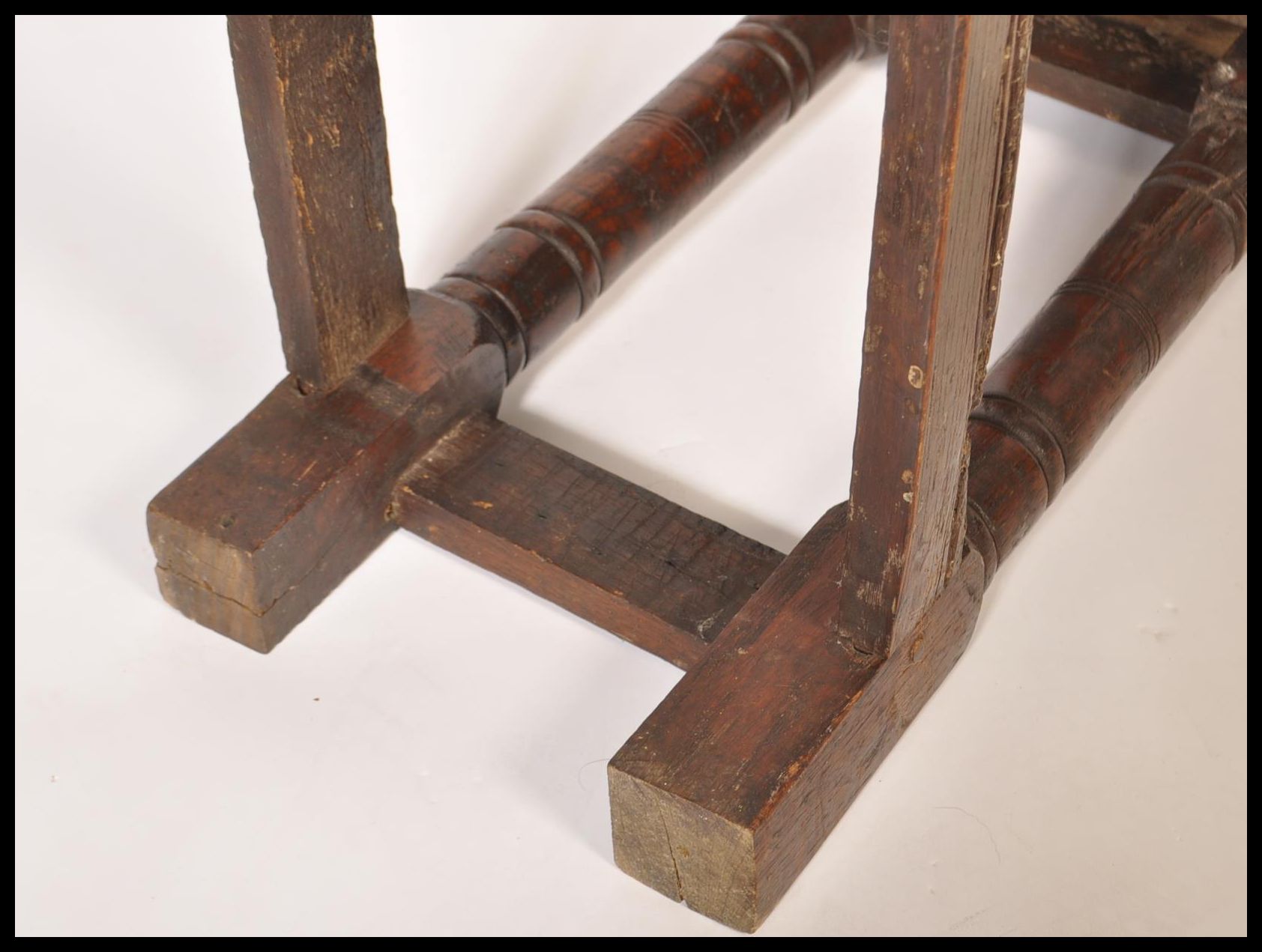 A 17th / 18th century country elm and oak joint stool. Unusual larger size with planked top over - Image 16 of 16