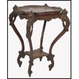 An Italian 19th century carved walnut tray top serving table. The top with lift offÿ carved and