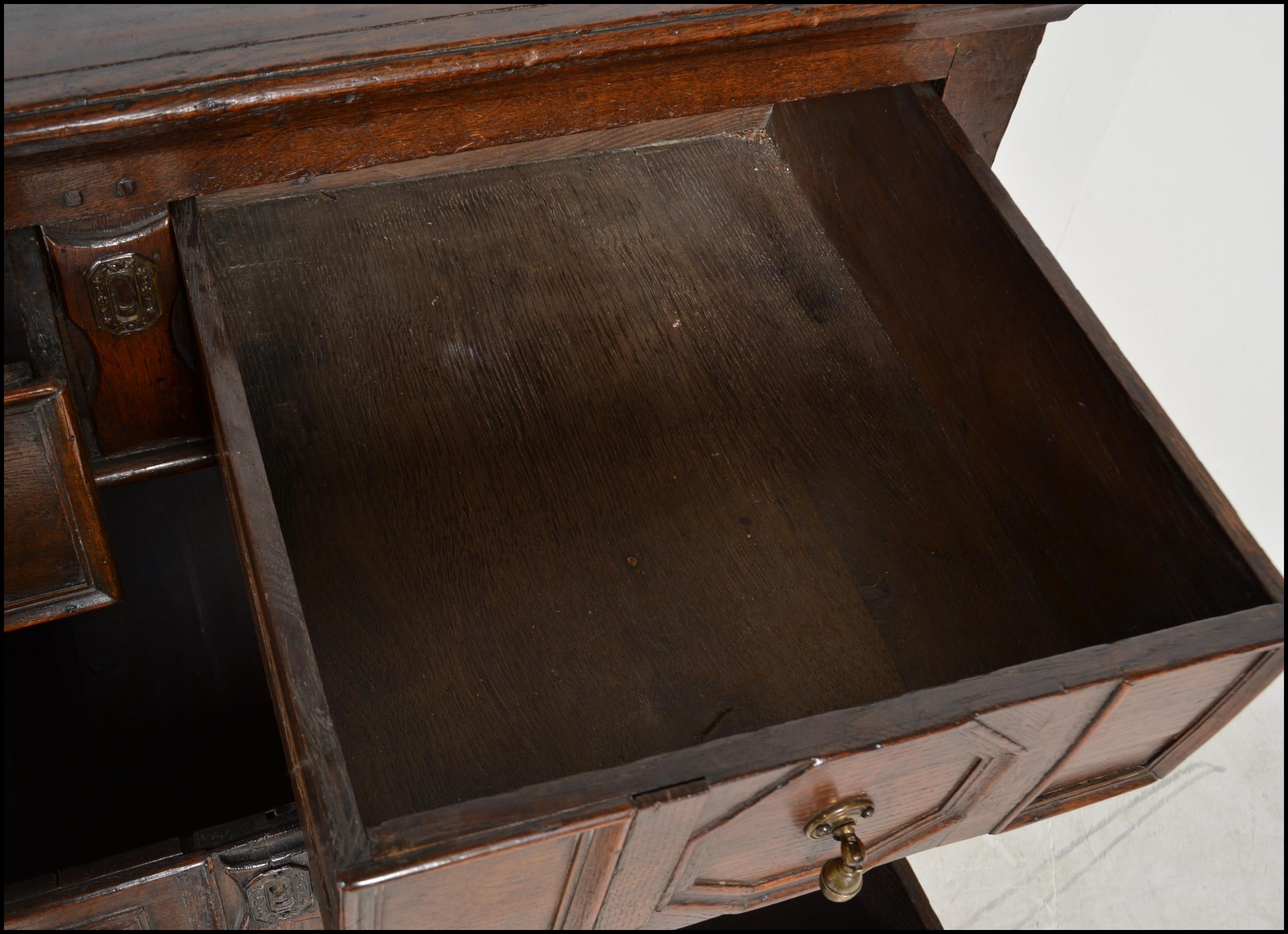 A 17th century Commonwealth oak block fronted chest of drawers. The bank of four drawers having - Image 15 of 16