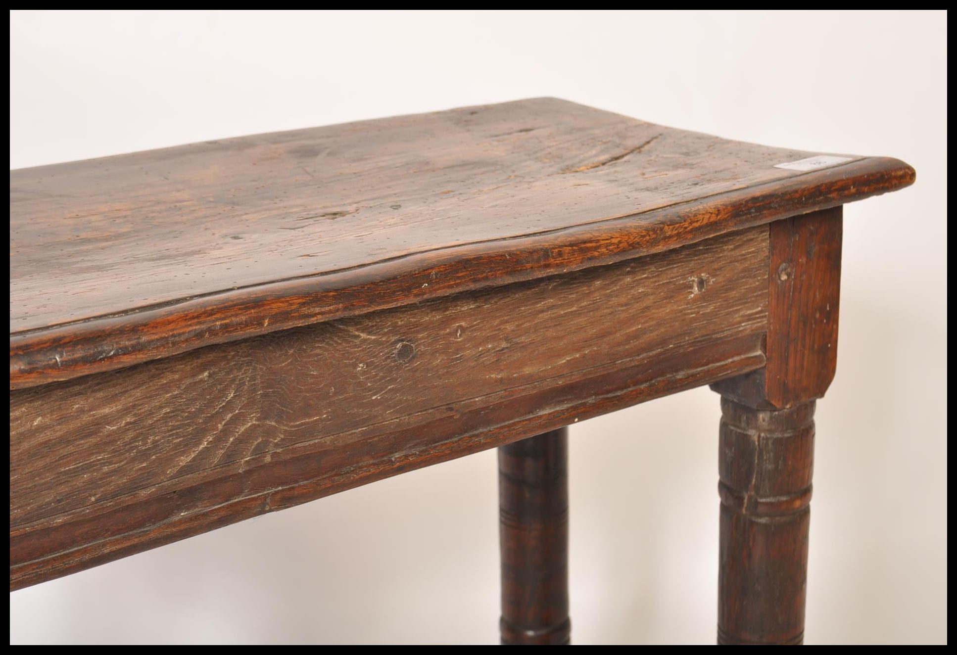 A 17th / 18th century country elm and oak joint stool. Unusual larger size with planked top over - Image 4 of 16