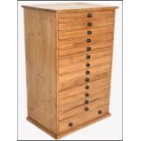 A Victorian 19th century large pine specimin chest of drawers- egg cabinet. Raised on a plinth