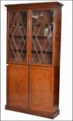 A fine 18th / 19th century George 3rd library solid mahogany bookcase cabinet. Raised on a plinth