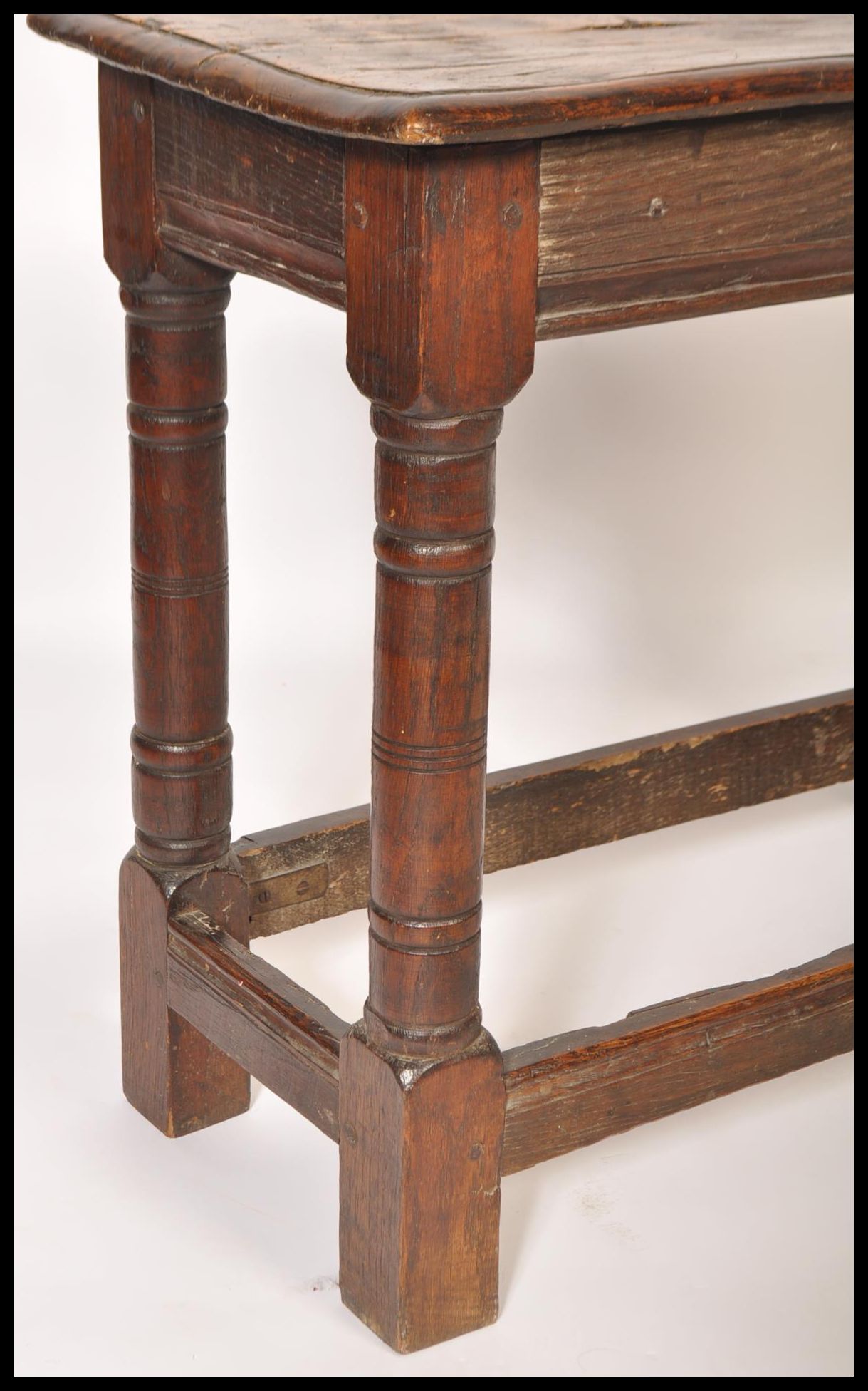 A 17th / 18th century country elm and oak joint stool. Unusual larger size with planked top over - Image 10 of 16