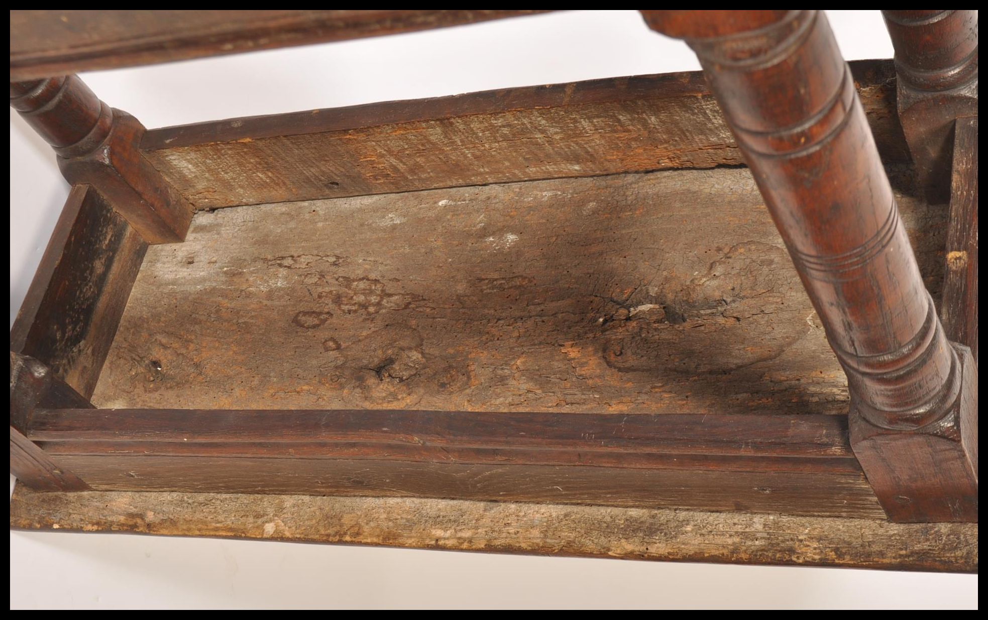A 17th / 18th century country elm and oak joint stool. Unusual larger size with planked top over - Image 14 of 16