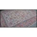 An early 20th century large Tabriz carpet rug. The rug with attractive palatte of colours having