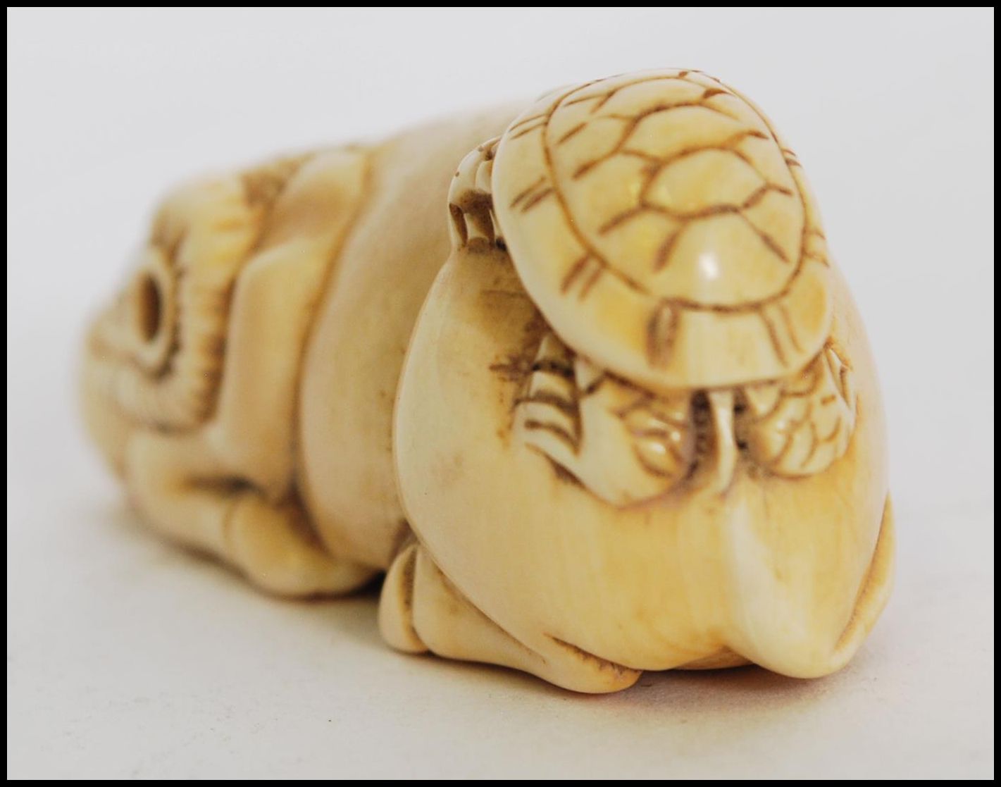 A rare and unusual 19th century Meiji period ivory Netsuke of a crouching / seated ox with - Image 3 of 6