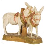 A Royal Dux figural group no 1111 circa 1900, modelled as two harnessed donkeys on naturalistic base