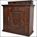 A 17th century oak Italian cupboard / cabinet. Raised over a banded plinth base with geometric