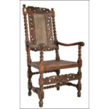 A 17th Century oak carved armchair / chair. The chair with carved top rail over barleytwist turned