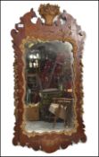 A large 19th century walnut pier mirror. The walnut surround embellished with gilt floral scroll