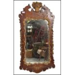 A large 19th century walnut pier mirror. The walnut surround embellished with gilt floral scroll