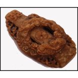 A Ming Dynasty 16th Century or older mutton fat jade panel having a central dragon roundel with