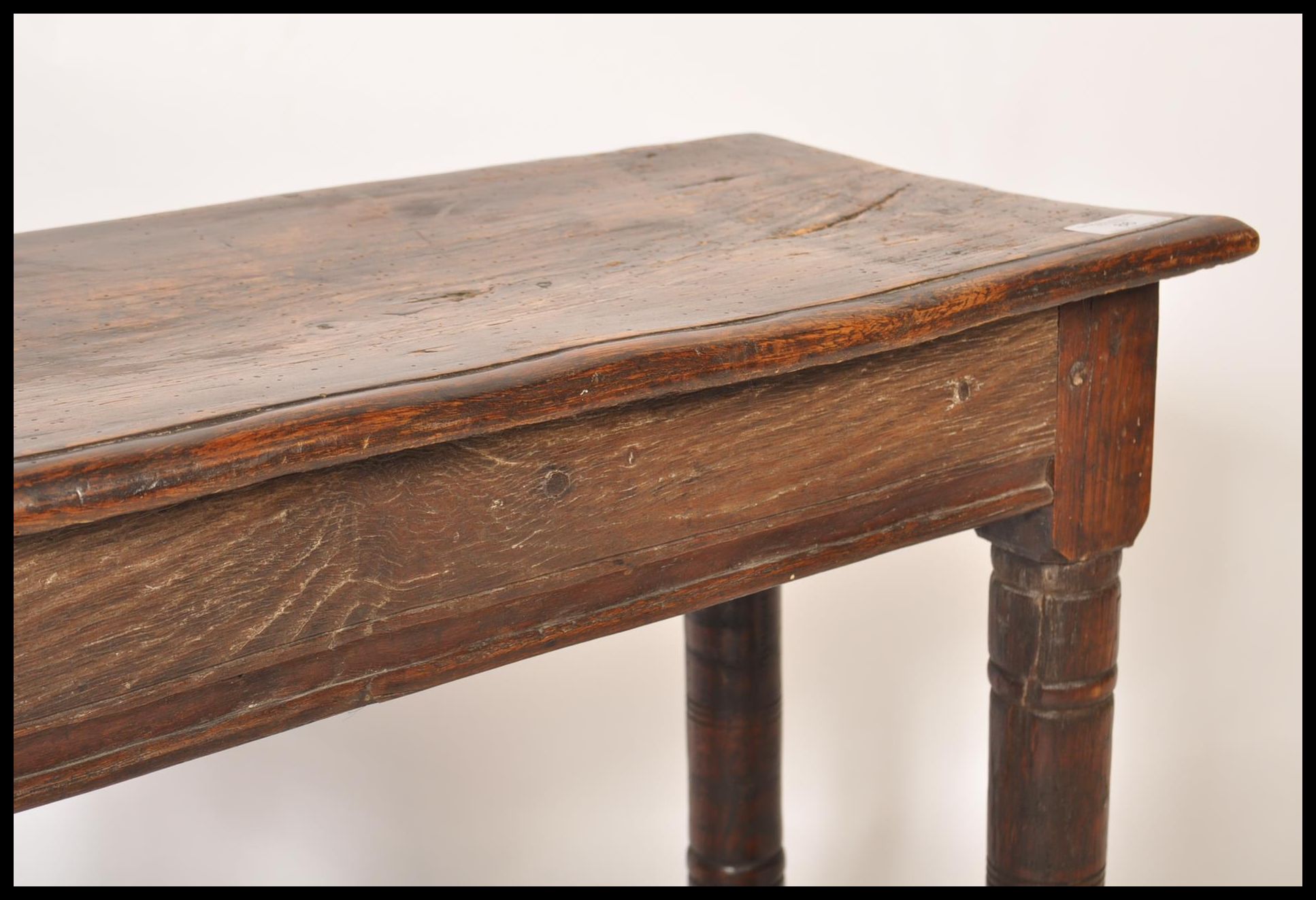 A 17th / 18th century country elm and oak joint stool. Unusual larger size with planked top over - Image 12 of 16