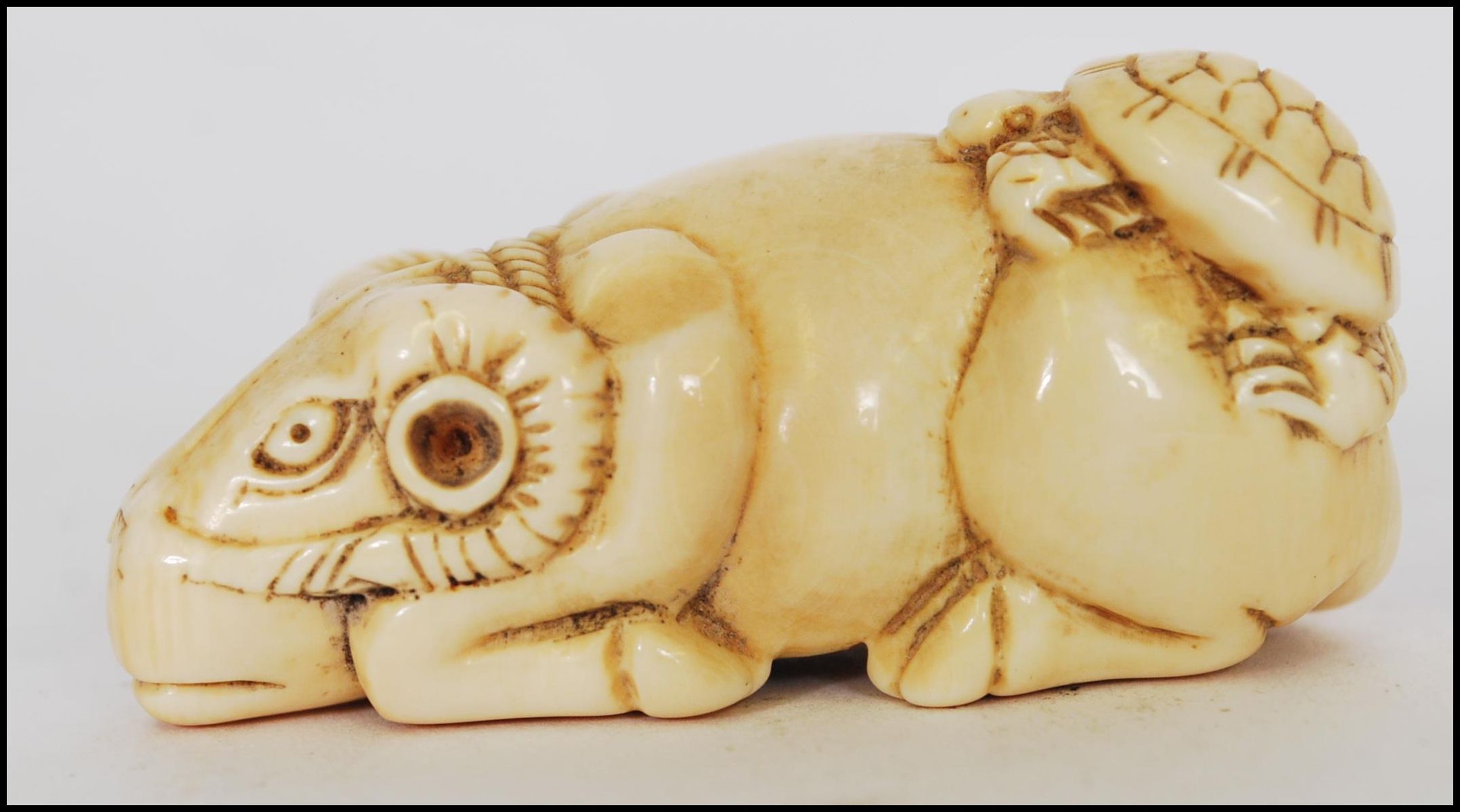 A rare and unusual 19th century Meiji period ivory Netsuke of a crouching / seated ox with - Image 4 of 6