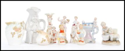 A collection of late 19th / early 20th Century Continental figurines to include females and males