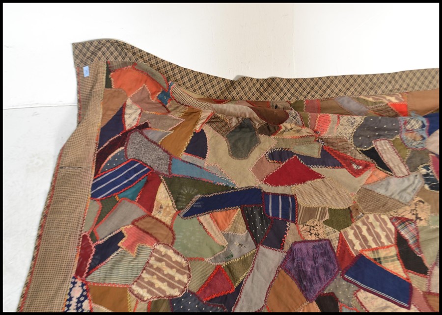 A vintage early 20th century patchwork throw / blanket / bed cover, constructed from various - Image 4 of 5