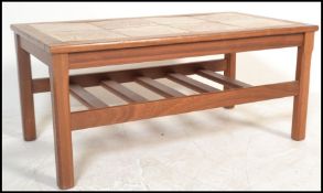 A retro 20th Century Danish inspired tile top teak wood coffee table together with a matching set of