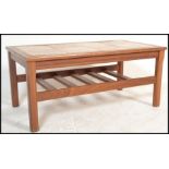 A retro 20th Century Danish inspired tile top teak wood coffee table together with a matching set of