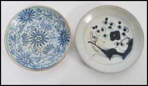 Two 18th century Chinese plates one having blue and white decoration and blue character mark to base
