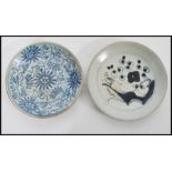 Two 18th century Chinese plates one having blue and white decoration and blue character mark to base