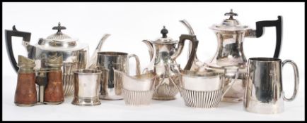 A collection of early 20th century silver plated items to include coffee / tea service comprising