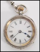 A continental silver 935 ladies pocket fob watch set to a decorative silver albert chain. The