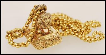 A gold plated pendant necklace having a pendant seal in the form of a lion with a spring ring clasp.