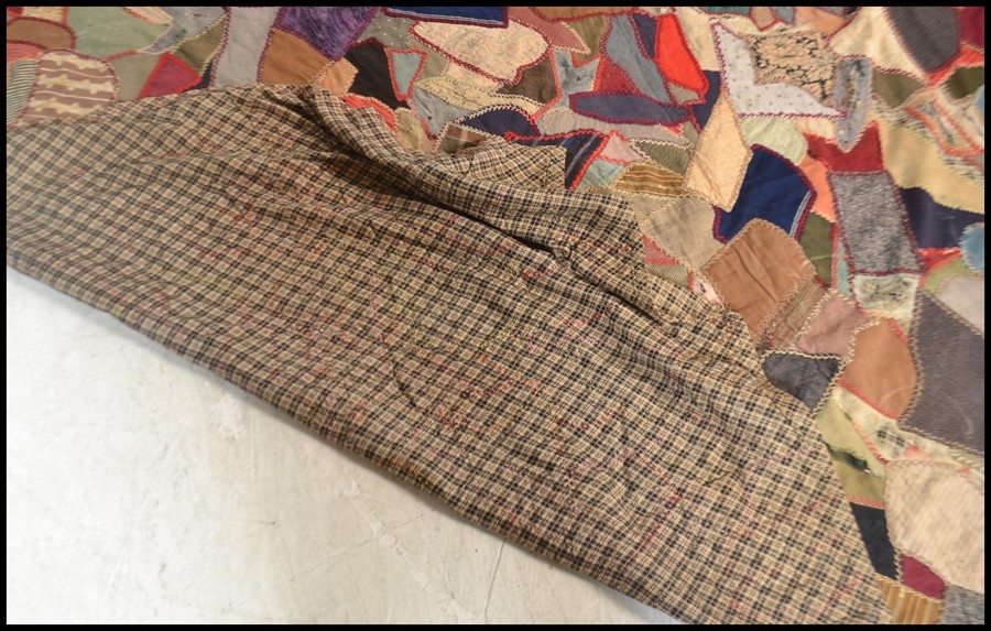 A vintage early 20th century patchwork throw / blanket / bed cover, constructed from various - Image 5 of 5