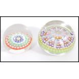 Two 20th Century paperweights to include a smaller glass domed paper weight with a coloured