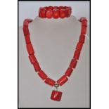 A large red coral necklace and bracelet jewellery set. The necklace having silver plated clasp and