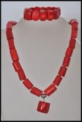 A large red coral necklace and bracelet jewellery set. The necklace having silver plated clasp and