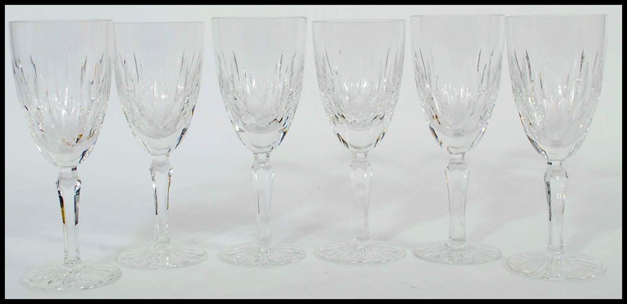 A set of 6 Edinburgh crystal cut glass wine glass having single stems with circular bases and