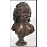 A 19th century bronze bust of a young girl with her ringlets of hair tied back, raised on a pedestal