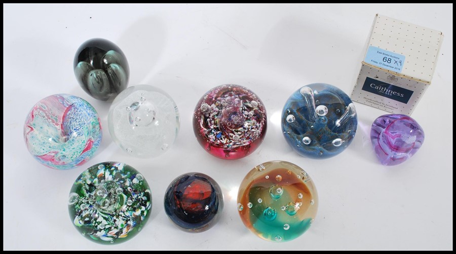 A collection of nine 20th century glass paperweights, the paperweights predominately by Caithness, - Image 2 of 4