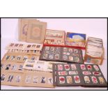 A large collection of vintage cigarette cards in albums and sets dating from the early to mid 20th