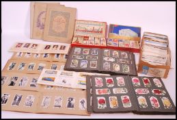 A large collection of vintage cigarette cards in albums and sets dating from the early to mid 20th