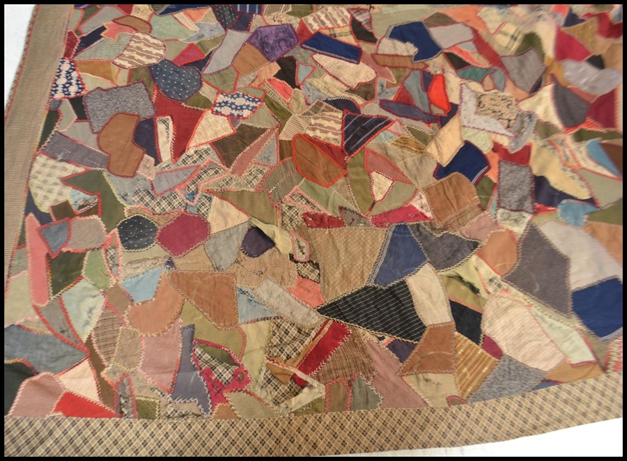 A vintage early 20th century patchwork throw / blanket / bed cover, constructed from various - Image 2 of 5