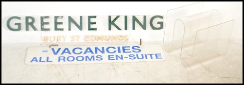 A 20th Century advertising sign for Green King, raised letters on clear acrylic back, another sign