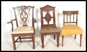 A collection of 3 19th Century chairs to include a Victorian mahogany hall chair with a  carved