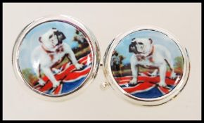 A pair of stamped 925 silver cufflinks having enamelled panels to the front depicting bulldogs.