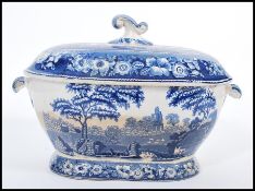 An early 19th century Georgian spode blue and white large tureen and lid having typical decoration