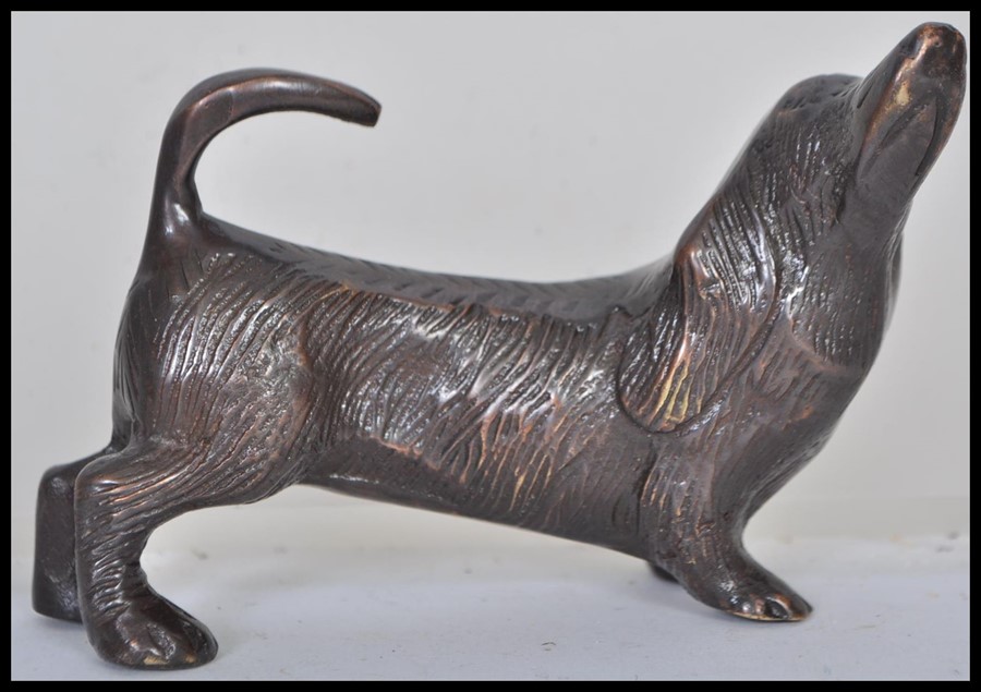 An early 20th century bronze statue figurine of a dachshund sausage dog modelled on all fours with