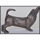 An early 20th century bronze statue figurine of a dachshund sausage dog modelled on all fours with